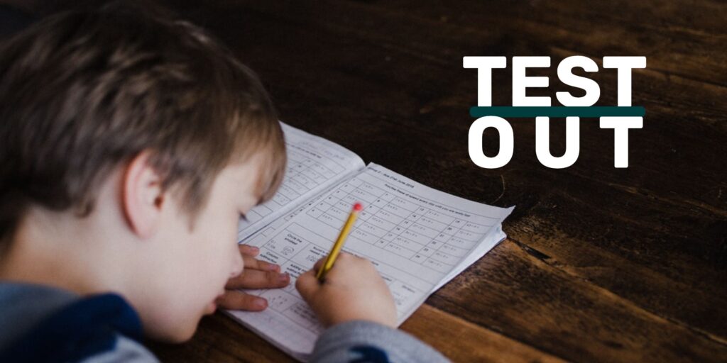 A child taking a match test intently with the words overlaid "Test Out."