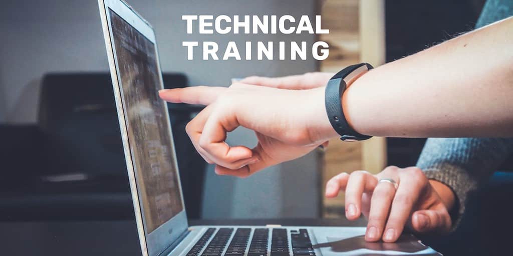 One hand on laptop keyboard with another hand pointing to the screen. Text overlaid: "Technical Training."
