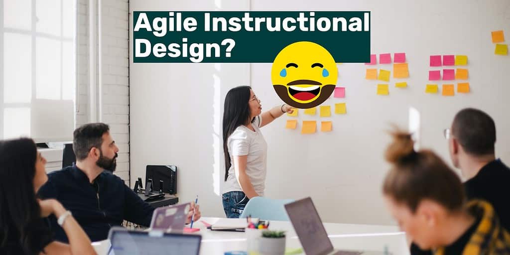 An conference room with someone standing up putting a sticky note on the wall with text overlay "Agile Instructional Design?" and a laughing emoji.